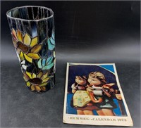 Stained glass lamp shade and a 1972 Hummel calenda