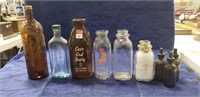 (9) Assorted Glass Bottles Including (4) Milk