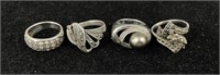 Four Sterling Silver Rings Varying sizes