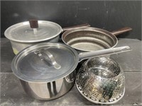 Pair of well used aluminum pots with a lid, and a