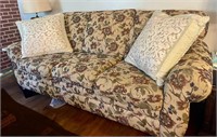7 ft Floral couch with wooden feet