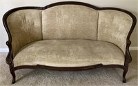 ANTIQUE VICTORIAN CARVED COUCH WITH TAN UPHOLSTERY