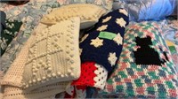 Crocheted afghans, and throw pillows