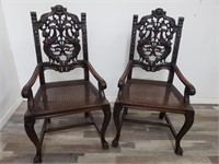 Pair of vintage carved wood arm chairs