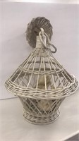 Antique hanging wicker bird cage with porcelain