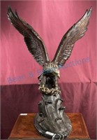 large bronze eagle in flight