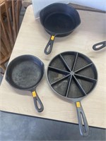 Vintage cast iron skillets and corns bread pan