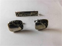 set of cufflinks and tie clip