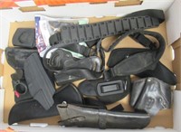 Assortment of slings and holsters.