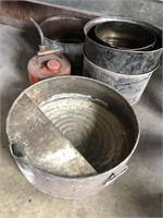 Group of galvanized oil cans and gas can
