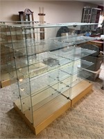 Glass Shelving Unit On Wooden Platform