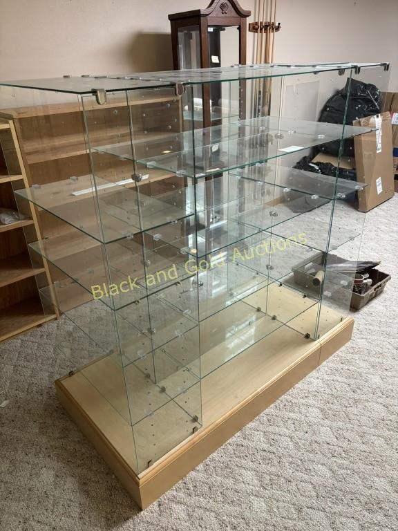 Glass Shelving Unit On Wooden Platform