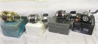 (4) Modern Bait Casting Reels with their boxes –