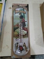 Metal Winchester thermometer with lady. About