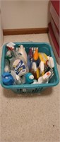 Laundry basket of assorted bathroom cleaning