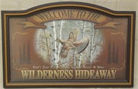 "Welcome to the Wilderness Hideaway" sign by