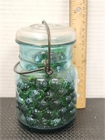 Vintage ball ideal #3 jar with green marbles