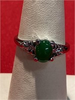 Jade ring set in Silvertone metal. Size 8 1/4.