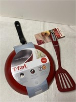 New T-Fal nonstick red skillet, KitchenAid turner