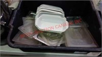 Bin with lasagna dishes and lids
