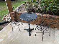 patio table with two chairs
