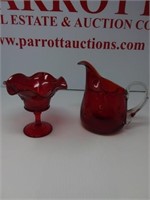Two pieces of red glass, pitcher and candy