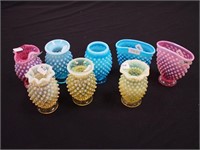 Eight pieces of colored opalescent hobnail glass