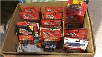 Box lot of racing champion toy cars, in the