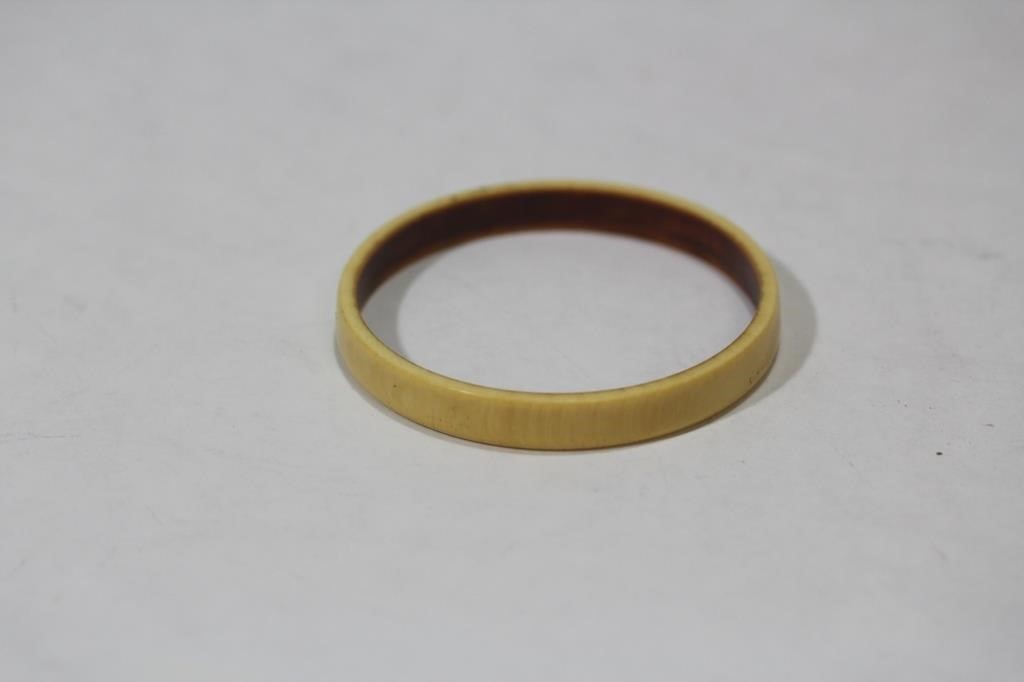 A Carved Bone Bangle Bracelet