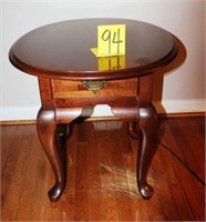 oval side table with drawer