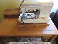Futura II sewing machine in cabinet w/ chair