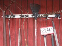 11 Long Handled Tools and Rack on Garage
