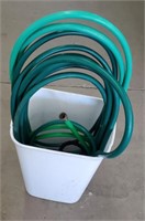 Trash Can With Garden Hoses