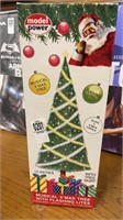 Model power musical Christmas tree with flashing