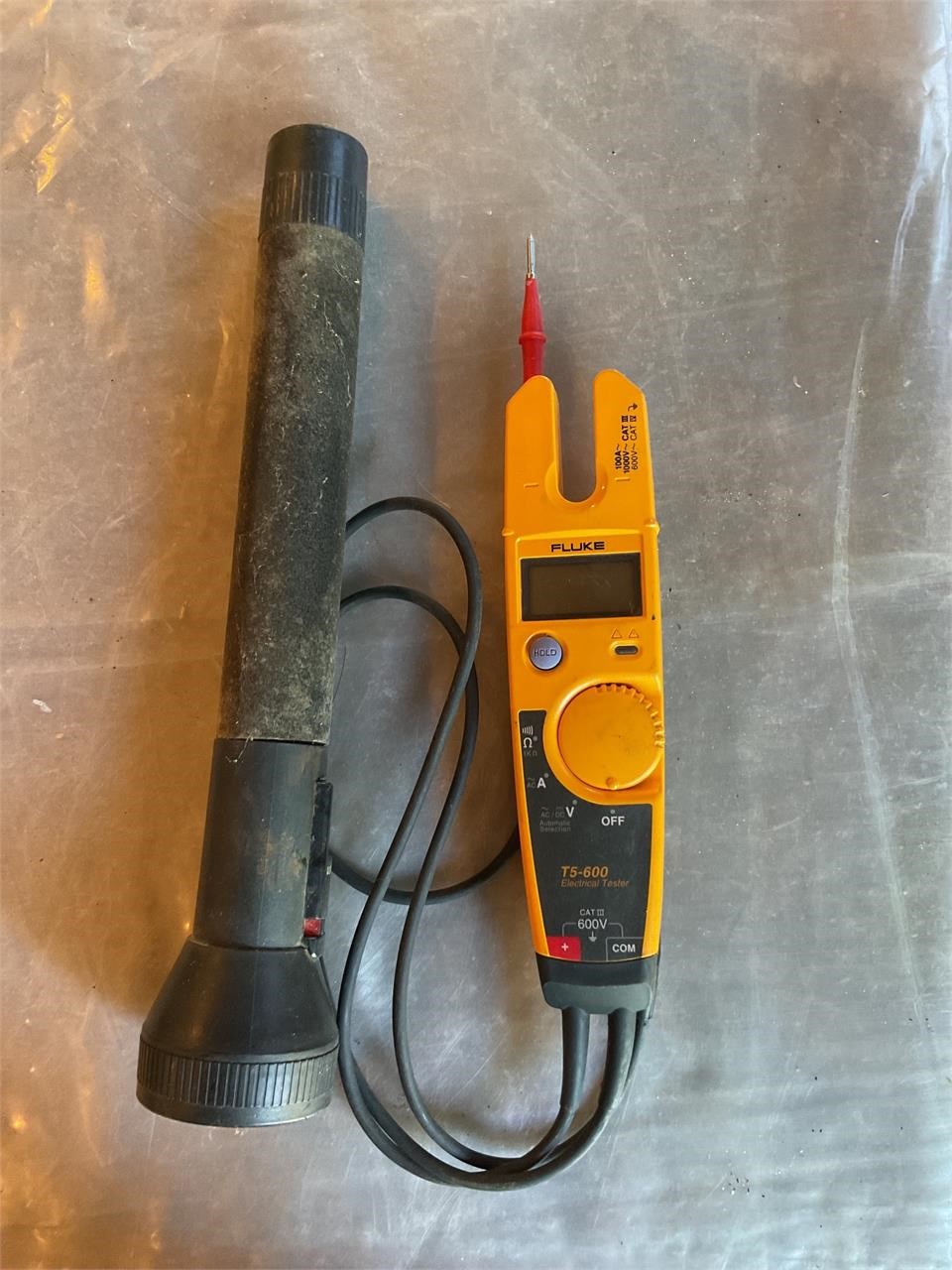Electrical tester and flashlight