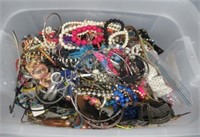 40 Qt. storage tote, 3/4 full of costume jewelry