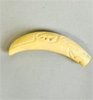 INUIT CARVED TOOTH SCULPTURE