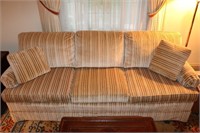 Tan and brown patterned sofa and a La-Z-Boy