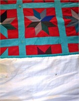 Approx. 4'x6' patchwork quilt on a hanging rod