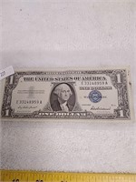 1957 series silver certificate $1 bill with blue