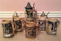 9 Unmatched pottery stein - 4 with relief, hand