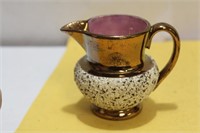 A Lusterware Ceramic Creamer