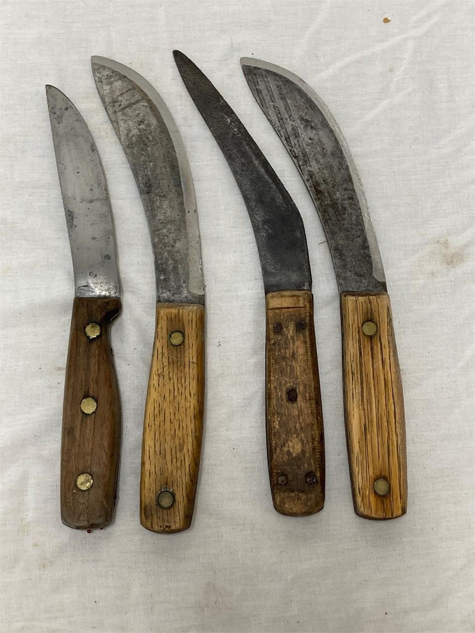 4 knives. Wood handles. 5 to 6” blades.