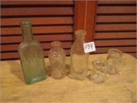 vintage glass bottles ONE is uranium glas.