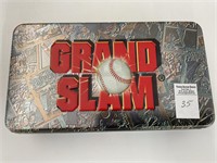 Grand slam tin with various loose cards