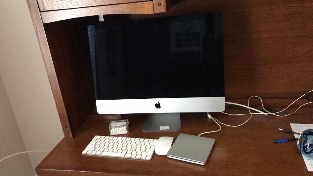 Apple Mac with keyboard, mouse, touchpad
