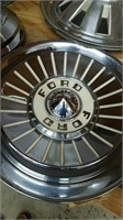 Set of four vintage Ford hubcaps