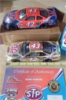 A SET OF 2 RACING CHAMPIONS DIECAST PETTY CARS