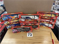 10 - 1:64 SCALE NASCAR RACING TEAM TRANSPORTERS