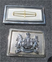 (2) Automobile emblum belt buckles.